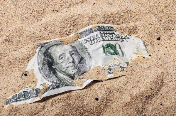 money buried in the sand